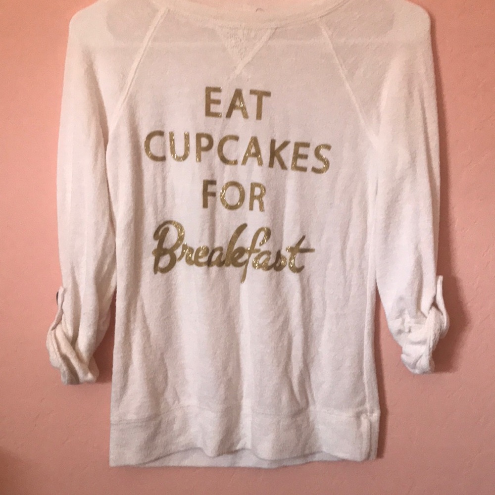 White shirt with gold letters